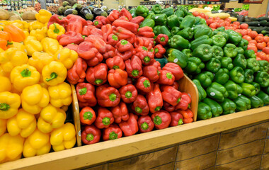 red and yellow peppers in market