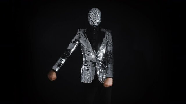 Mr disco ball wearing silver jacket dancing