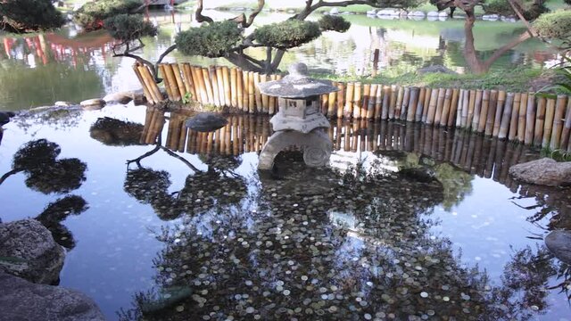 Japanese coin fount with a lake in the background