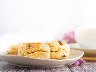 Traditional British scones with a tea cup and blurred background