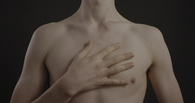 Male breathing with hand on chest shot in 4K
