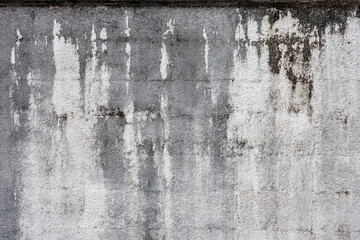 染みのある古いコンクリートの壁