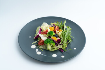 A plate of delicious and healthy green vegetable salad.