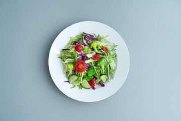 A plate of delicious and healthy green vegetable salad.