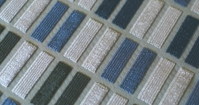 4K High End Upholstery, Vintage Blue White Grey Color Panels Fabric Texture Rotating in Cinematic Slow Motion with Macro Focus