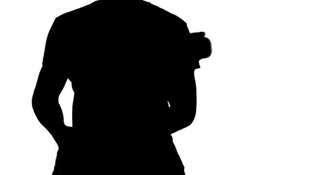 Black silhouette  of young guy playing electric guitar on white background.