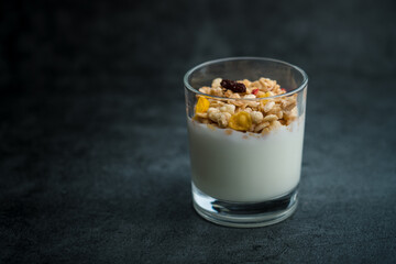 A cup of western-style breakfast oatmeal yogurt.A glass of western breakfast oatmeal milk