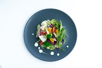 A plate of delicious and healthy green vegetable salad.