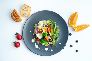 A plate of healthy and delicious salad and a bread