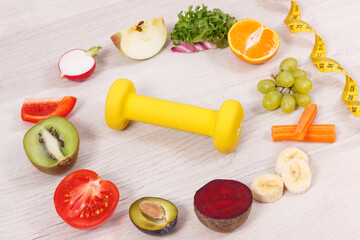 Dumbbell, centimeter and nutritious food as source natural vitamins, healthy nutrition and slimming concept