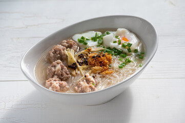 Thai style clear soup rice noodle in traditional bowl. Selective focus
