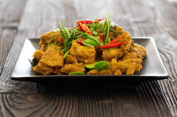 Stir Fried Pork Ribs Red Curry Paste And Coconut Milk.