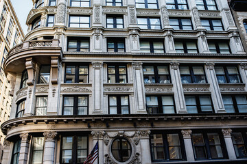 New York street pedestrian direction sign. Street name signs in Manhattan. Building sign. New York streets. Empty streets. New York buildings.  Old architecture buildings in Manhattan. Home facades. 