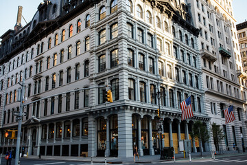 New York street pedestrian direction sign. Street name signs in Manhattan. Building sign. New York streets. Empty streets. New York buildings.  Old architecture buildings in Manhattan. Home facades. 