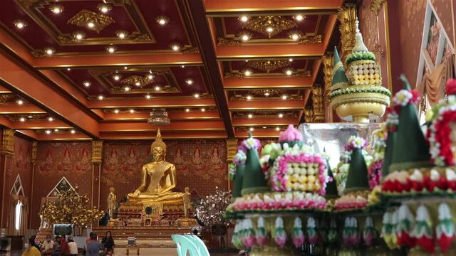 A decorated interior with golden statue of Buddha at Buddhist temple Wat Khun Inthapramun.