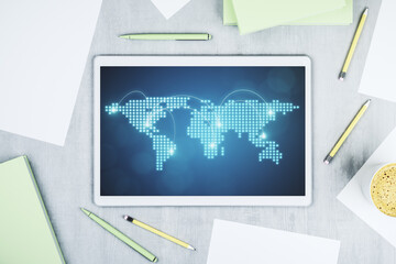 Abstract creative world map with connections on modern digital tablet screen, international trading concept. Top view. 3D Rendering