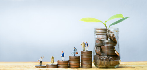 Miniature people standing on stack of coins. Inequality and social class. Income and economic inequality concept. Inequality in social class, ideology, Gender, Racial and ethnic and health.