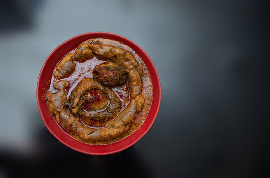 A bowl of amala with ewedu and gbegiri sauce with stewed fried mackarel and eja kika