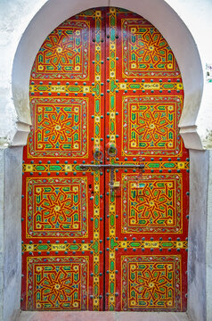 Ornate hand painted door of a traditional Moroccan house in Fes
