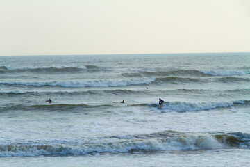 Fototapeta na wymiar Surfers