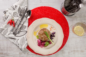 cutlet of the two types of meat stuffed with greens