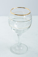 Crystal glasses with gold patterns. Selective focus