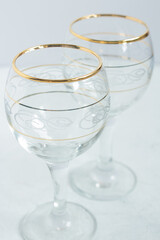 Crystal glasses with gold patterns. Selective focus