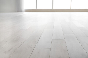 View of clean laminate floor in empty room - obrazy, fototapety, plakaty