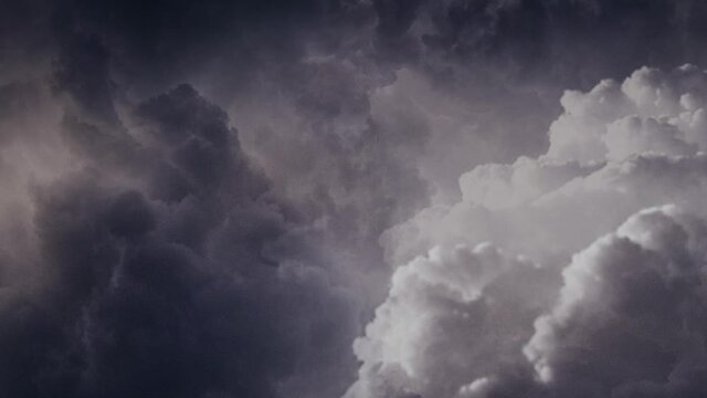 black clouds accompanied by lightning strikes