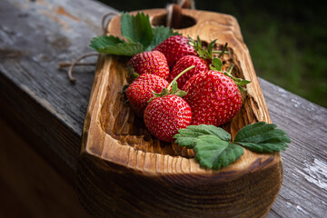 Close-up of beautiful red strawberries on wood