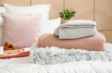 Soft plaids on bed in room