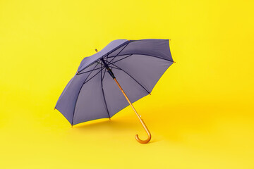 Stylish umbrella on color background