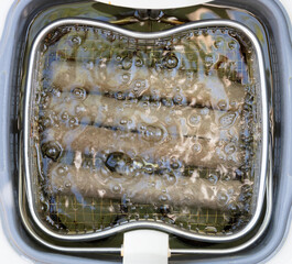 Frikadellen, a Dutch fast food snack in the oil