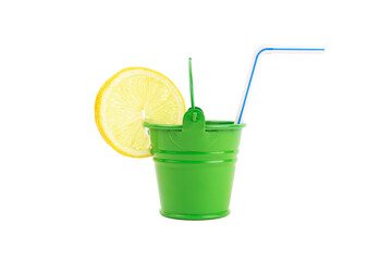 Closeup of a green water bucket with a lemon slice and a drinking straw isolated on white. Thirst-quencher for a hot summer.