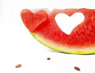 Naklejka na ściany i meble Bright juicy red watermelon in the form of a heart. Space for text. Sweet Valentine's day.