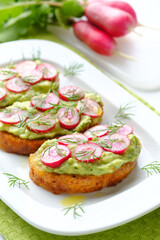 Delicious vegan sandwiches with radish and avocado