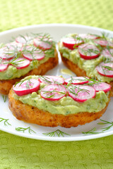 Three delicious vegan sandwiches with radish and avocado