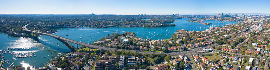 Aerial view of the Gladesville bridge, Parramatta river and the Sydney  suburb of drummoyne looking east towards the city.