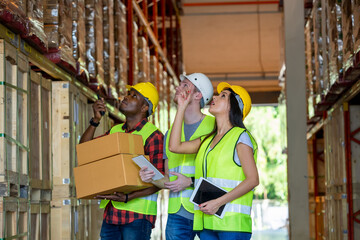 Meeting at warehouse,Warehouse workers working together at warehouse.