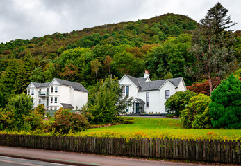 Isolated blackrock houses in the Scottish Highlands, near village Ballachulish.