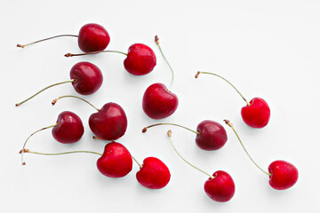 Naklejka na ściany i meble Ripe sweet cherry berries on a white background