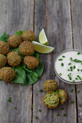 Chickpea falafel balls with sauce and tomatoes