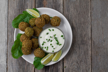 Chickpea falafel balls with sauce and tomatoes