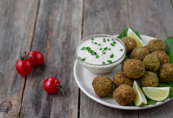 Chickpea falafel balls with sauce and tomatoes