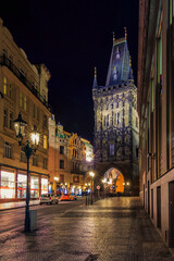 Fototapeta na wymiar Powder Tower at night, built in 1475, a high Gothic tower in Prague, Czech Republic