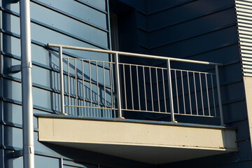 The metal triangular balcony of the modern metal building of the sports complex, technical non-residential building, fitness club, pool, gym.