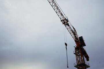 building steel yellow, crane in blue sky 