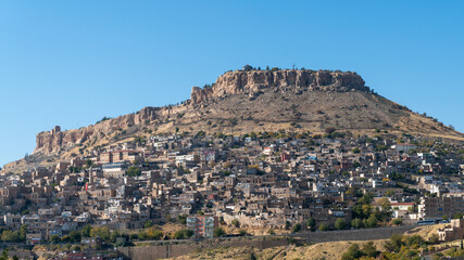 Fototapeta na wymiar Town of Savur skyline with old stone houses on a hill, Mardin, Turkey.