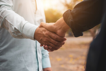 People shake hand greeting teamwork partnership friendship outdoor community
