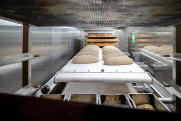 in cold storage room the loaves of bread lie side by side on the table